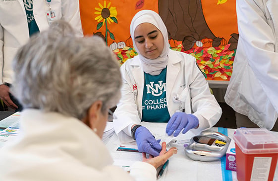 A healthcare worker taking a patient's blood sample