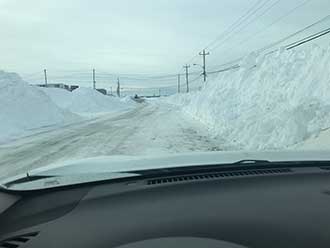 A van driving down a snowy road